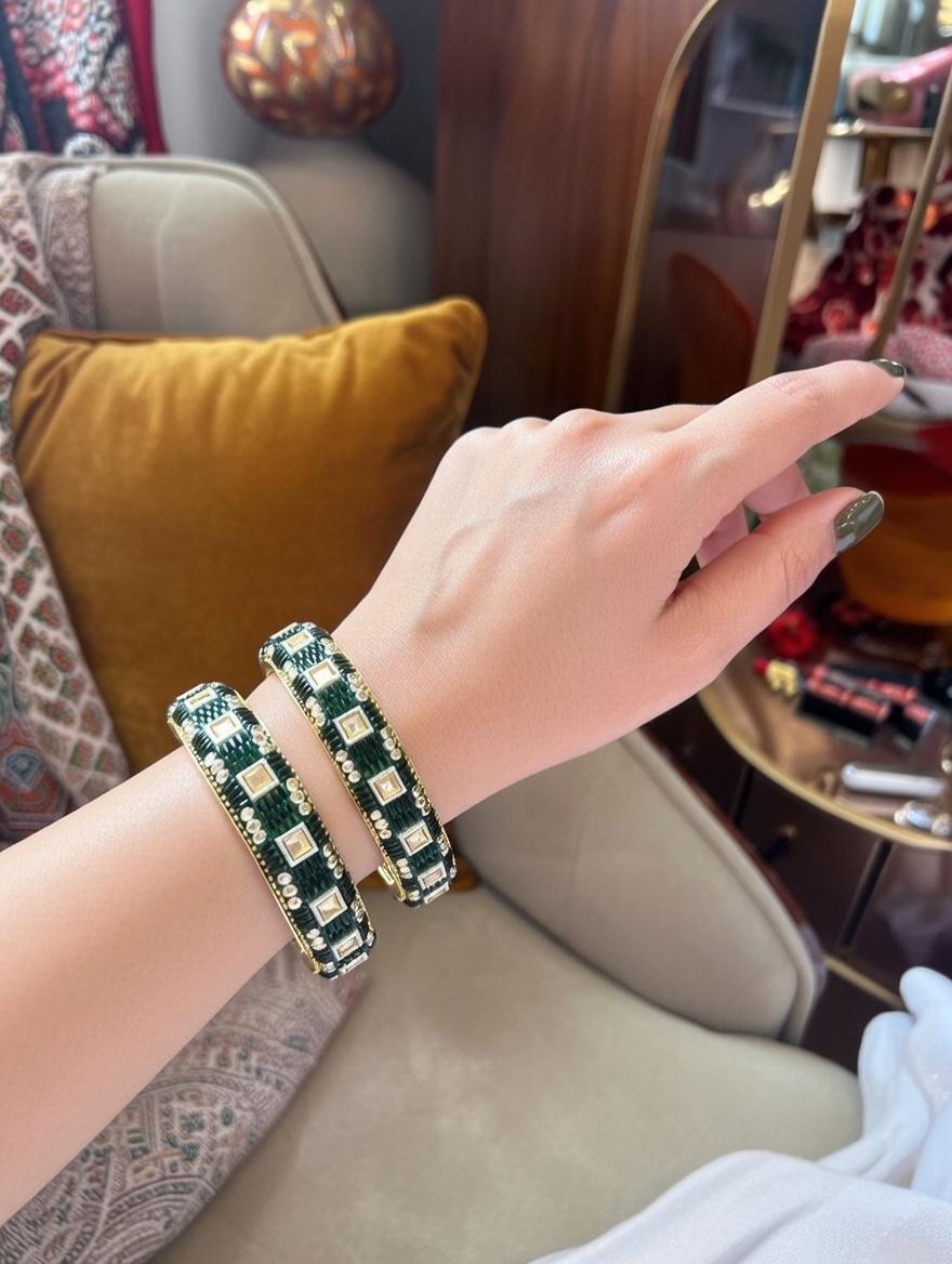 "Dark green lac bangles with traditional mirror work for Indian weddings"